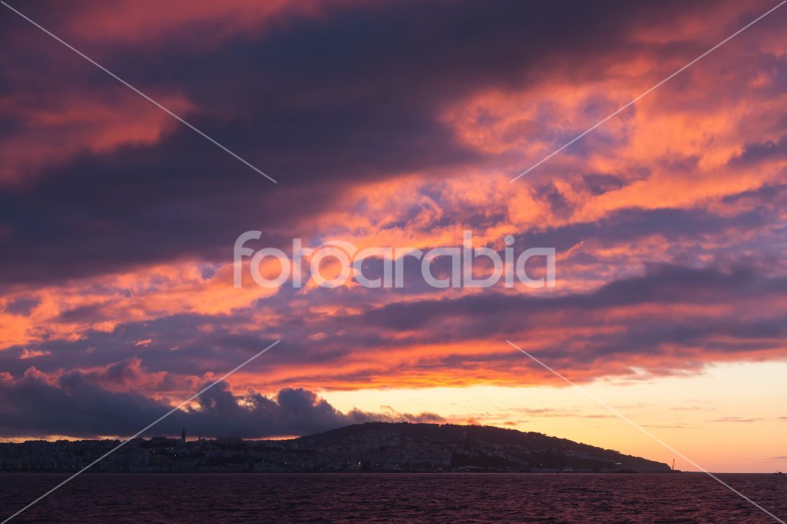 Bright sunset sky. Tangier, Morocco